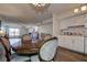 Dining room flowing into the living room and a glimpse of the updated kitchen at 6400 46Th N Ave # 307, Kenneth City, FL 33709