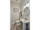 Charming half bathroom with classic pedestal sink and decorative mirror at 7425 245Th E St, Myakka City, FL 34251