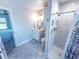 Bathroom featuring a single sink vanity, tiled shower and marble look shower at 7425 245Th E St, Myakka City, FL 34251