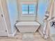 Elegant bathroom featuring a modern soaking tub and a window with plantation shutters at 7425 245Th E St, Myakka City, FL 34251