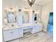 Beautiful bathroom featuring marble countertops, framed mirrors, and double sinks at 7425 245Th E St, Myakka City, FL 34251