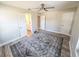 Bedroom with ceiling fan, wood-look floors, and ensuite access at 7425 245Th E St, Myakka City, FL 34251