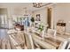 Elegant dining area with a fireplace and sliding doors to the patio, offering a warm and inviting atmosphere at 7425 245Th E St, Myakka City, FL 34251