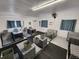 Interior view of a dog kennel room with multiple crates and padded areas, designed for canine comfort at 7425 245Th E St, Myakka City, FL 34251
