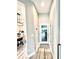 Bright entryway featuring a decorative front door and views into a dining area with stylish decor at 7425 245Th E St, Myakka City, FL 34251