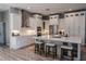 Bright kitchen features all white cabinets, stainless steel appliances, and a large island with quartz countertops at 7425 245Th E St, Myakka City, FL 34251