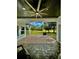 Outdoor patio with ceiling fan, stone floors and a picturesque view of the yard at 7425 245Th E St, Myakka City, FL 34251