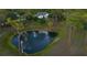 Picturesque view of a pond with a fountain, surrounded by trees and natural beauty, enhancing the property's charm at 7425 245Th E St, Myakka City, FL 34251