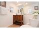 Bathroom with wood vanity, neutral paint and decor, with tiled flooring at 960 Starkey Rd # 3106, Largo, FL 33771