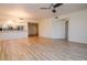 Open living area with wood floors and view of the kitchen at 960 Starkey Rd # 3106, Largo, FL 33771