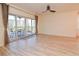 Bright living room featuring wood floors and glass sliding doors to a balcony at 960 Starkey Rd # 3106, Largo, FL 33771