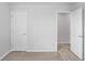 Bedroom features neutral carpet, white trim, and doorways to other parts of the house at 10822 Windswept Garden Way, Tampa, FL 33647