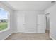 Bright and airy bedroom with neutral carpet, offering a serene and comfortable space at 10822 Windswept Garden Way, Tampa, FL 33647