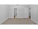 Neutral carpet bedroom with two doors, creating an airy space at 10822 Windswept Garden Way, Tampa, FL 33647