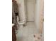 Bathroom featuring tile flooring, toilet, mushroom rug, and tall cabinet at 10933 Subtle Trail Dr, Riverview, FL 33569