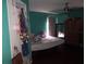 Bedroom featuring hardwood floors, natural light, ample closet and decor at 10933 Subtle Trail Dr, Riverview, FL 33569