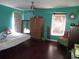 Bright bedroom featuring hardwood floors, natural light, and ample closet space at 10933 Subtle Trail Dr, Riverview, FL 33569