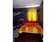bedroom with dark blue walls and yellow curtains at 10933 Subtle Trail Dr, Riverview, FL 33569