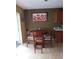 A cozy dining area featuring a wood table set for four, and lots of wall decor at 10933 Subtle Trail Dr, Riverview, FL 33569