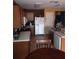 Functional kitchen with stainless steel sink, wood cabinets, and appliances at 10933 Subtle Trail Dr, Riverview, FL 33569