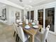 Dining room with an elegant chandelier and views of a wine room at 1123 Hounds Run, Safety Harbor, FL 34695