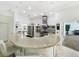 Modern kitchen with stainless steel appliances and a stone countertop with seating at 1123 Hounds Run, Safety Harbor, FL 34695