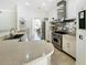 Modern kitchen with stainless steel appliances, custom cabinetry, and an open layout at 1123 Hounds Run, Safety Harbor, FL 34695