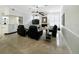 Tile flooring, a fireplace, and wall-mounted TV give the living room a cozy and modern feel at 1123 Hounds Run, Safety Harbor, FL 34695