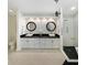Spa-like bathroom with double sinks, granite countertops, and a walk-in shower with a stone floor at 1123 Hounds Run, Safety Harbor, FL 34695