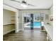 Office space showing built-ins, pool access, and sliding glass door at 1123 Hounds Run, Safety Harbor, FL 34695