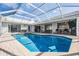 Beautiful in-ground pool with brick patio, perfect for relaxing and entertaining at 1123 Hounds Run, Safety Harbor, FL 34695