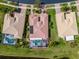 Aerial view of home with a pool, mature landscaping, and close proximity to neighbors at 16206 Diamond Bay Dr, Wimauma, FL 33598
