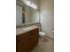 Bathroom featuring granite countertop vanity with sink, toilet, and shower/tub combo with glass door at 16206 Diamond Bay Dr, Wimauma, FL 33598