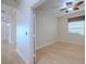 Bedroom with hardwood floors, ceiling fan, and window at 16206 Diamond Bay Dr, Wimauma, FL 33598
