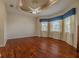 Spacious bedroom with a unique ceiling, ceiling fan, and large windows at 16206 Diamond Bay Dr, Wimauma, FL 33598