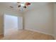 Neutral bedroom with a ceiling fan and two closets at 16206 Diamond Bay Dr, Wimauma, FL 33598