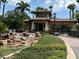 Community entrance waterfall and guard house featuring stone accents and lush landscaping in a tropical setting at 16206 Diamond Bay Dr, Wimauma, FL 33598