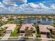 Beautiful lakefront home with a tile roof, lush landscaping, and a two-car garage, in an active adult community at 16206 Diamond Bay Dr, Wimauma, FL 33598