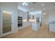 Modern kitchen with stainless steel appliances, custom cabinets, and a pantry at 16206 Diamond Bay Dr, Wimauma, FL 33598