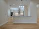 Modern kitchen featuring stainless steel appliances, custom cabinets and a kitchen island at 16206 Diamond Bay Dr, Wimauma, FL 33598