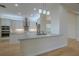 Modern kitchen with stainless steel appliances, custom cabinets and a kitchen island at 16206 Diamond Bay Dr, Wimauma, FL 33598