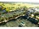 Beautiful aerial view of tennis courts, lush landscaping, and community amenities at 17520 Gawthrop Dr # 106, Lakewood Ranch, FL 34211