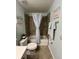 Bathroom with ceramic tile flooring, decorative accents, and combined shower and tub at 17520 Gawthrop Dr # 106, Lakewood Ranch, FL 34211