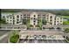 Beautiful condo exterior with covered parking, lush landscaping, and a view of the surrounding community at 17520 Gawthrop Dr # 106, Lakewood Ranch, FL 34211
