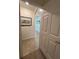 Bright hallway with tiled floor leads to other rooms at 17520 Gawthrop Dr # 106, Lakewood Ranch, FL 34211