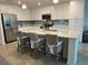 Modern kitchen with stainless steel appliances, a center island, and white cabinetry at 17520 Gawthrop Dr # 106, Lakewood Ranch, FL 34211