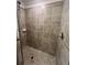 Tiled walk-in shower features a rainfall shower head and a handheld sprayer at 17520 Gawthrop Dr # 106, Lakewood Ranch, FL 34211