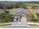 Property aerial view showing landscaping, neighborhood location near a pond, and well-maintained yards at 19317 Hawk Valley Dr, Tampa, FL 33647