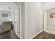 View of hallway with hardwood floors leading to rooms and doorways at 19317 Hawk Valley Dr, Tampa, FL 33647