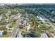 Wide aerial shot of the property, revealing landscaping details, driveway, nearby homes, and street access at 2829 9Th W Ave, Bradenton, FL 34205